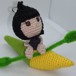 Figurine avec canoë vert/jaune